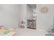 Playroom featuring a play kitchen, baby gate and stylish round mirror at 14360 W Windrose Dr, Surprise, AZ 85379