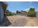 A spacious backyard with a rock landscape, a covered patio, and lush greenery at 14412 N 39Th Ave, Phoenix, AZ 85053