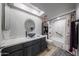 Bathroom featuring a vessel sink, updated vanity, tub, shower and a skylight at 14412 N 39Th Ave, Phoenix, AZ 85053
