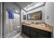 Bathroom featuring a square sink with a wood countertop, vanity with stone details and a shower with a white curtain at 14412 N 39Th Ave, Phoenix, AZ 85053
