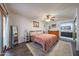 Bedroom with hard surface floors, accent rug, sliding glass door, and ensuite bathroom at 14412 N 39Th Ave, Phoenix, AZ 85053