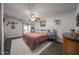 Bedroom with hard surface floors, accent rug, sliding glass door and ceiling fan at 14412 N 39Th Ave, Phoenix, AZ 85053