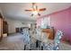 Dining area featuring a glass-top table, stylish chairs, and easy access to other living spaces at 14412 N 39Th Ave, Phoenix, AZ 85053
