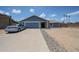 Charming single-Gathering home with blue exterior, well-maintained landscaping, and attached two-car garage at 14412 N 39Th Ave, Phoenix, AZ 85053