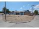 Charming single-Gathering home with blue exterior, well-maintained landscaping, and attached two-car garage at 14412 N 39Th Ave, Phoenix, AZ 85053