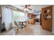 Cozy eat-in kitchen featuring tile floors, a breakfast table and natural light from the oversized window at 14412 N 39Th Ave, Phoenix, AZ 85053
