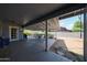 Covered patio with concrete floor, features a table and chairs set for outdoor dining at 14412 N 39Th Ave, Phoenix, AZ 85053
