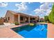 Beautiful backyard showcasing a sparkling pool, covered patio, and spacious layout at 16609 N 40Th Dr, Phoenix, AZ 85053