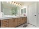 Bright bathroom with double sinks, marble counters, framed mirrors, and lots of storage space at 16609 N 40Th Dr, Phoenix, AZ 85053