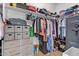 Well-organized walk-in closet featuring a variety of clothing, shelving, and storage options at 16609 N 40Th Dr, Phoenix, AZ 85053