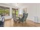 Elegant dining area with modern chandelier, glass table, and stylish upholstered chairs at 16609 N 40Th Dr, Phoenix, AZ 85053