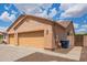 View of the attached three-car garage, offering plenty of parking and storage at 16609 N 40Th Dr, Phoenix, AZ 85053
