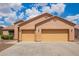 Attached three-car garage offering plenty of parking and storage space for vehicles and equipment at 16609 N 40Th Dr, Phoenix, AZ 85053