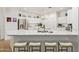 Open kitchen with bar stool seating, stainless steel appliances, and plenty of counter space at 16609 N 40Th Dr, Phoenix, AZ 85053