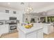 Bright kitchen with white cabinets, stainless steel appliances, and marble countertops at 16609 N 40Th Dr, Phoenix, AZ 85053