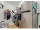Convenient laundry room with modern washer and dryer and ample shelving for organization at 16609 N 40Th Dr, Phoenix, AZ 85053