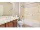 Cozy bathroom featuring a vanity sink, toilet, and tub with shower head and grab bar at 16704 W Oracle Rim Dr, Surprise, AZ 85387