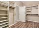 Spacious walk-in closet featuring built-in shelving and racks for organized storage solutions at 16704 W Oracle Rim Dr, Surprise, AZ 85387