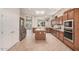 Spacious kitchen features wooden cabinets, stainless steel appliances, and a large island at 16704 W Oracle Rim Dr, Surprise, AZ 85387