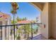Relaxing balcony with a picturesque view of the community pool and desert landscaping at 16715 E El Lago Blvd # 212, Fountain Hills, AZ 85268