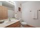 Bathroom with sink, vanity, small mirror, tile floors, and toilet at 16715 E El Lago Blvd # 212, Fountain Hills, AZ 85268