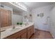 Bathroom with double sinks, vanity, large mirror, tile floors, and shower/tub combo at 16715 E El Lago Blvd # 212, Fountain Hills, AZ 85268