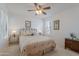 Bright bedroom with ceiling fan, bedside tables, and a Palm Springs themed comforter at 16715 E El Lago Blvd # 212, Fountain Hills, AZ 85268