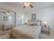 Bright bedroom with ceiling fan, bedside tables, large mirrored closet, and a Palm Springs themed comforter at 16715 E El Lago Blvd # 212, Fountain Hills, AZ 85268