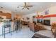Open clubhouse floor plan with fireplace, bar seating, and comfortable seating at 16715 E El Lago Blvd # 212, Fountain Hills, AZ 85268