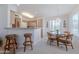 Bright dining area featuring a chandelier, breakfast bar, and lots of natural light at 16715 E El Lago Blvd # 212, Fountain Hills, AZ 85268