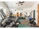 Home gym features multiple workout machines, weights, and a mirrored wall at 16715 E El Lago Blvd # 212, Fountain Hills, AZ 85268