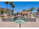 Relaxing community hot tub surrounded by mature desert landscaping and palms at 16715 E El Lago Blvd # 212, Fountain Hills, AZ 85268