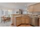 Bright kitchen with stainless steel appliances and tile countertops is adjacent to an eat-in kitchen and dining area at 16715 E El Lago Blvd # 212, Fountain Hills, AZ 85268