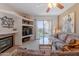 Spacious living room featuring a fireplace and sliding doors to outside at 16715 E El Lago Blvd # 212, Fountain Hills, AZ 85268