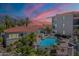 Inviting community pool surrounded by lush landscaping and elegant buildings, perfect for relaxation at 16715 E El Lago Blvd # 212, Fountain Hills, AZ 85268