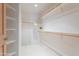 Bright walk-in closet with shelves, racks, and carpeted floors at 16715 E El Lago Blvd # 212, Fountain Hills, AZ 85268