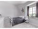 Peaceful bedroom featuring a comfortable bed, soft natural light, and neutral décor, perfect for relaxation at 1914 N Marketside Ave, Buckeye, AZ 85396