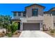 Charming two-story home featuring a two-car garage, landscaped yard, and a mix of modern and traditional architectural styles at 1914 N Marketside Ave, Buckeye, AZ 85396