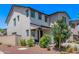 Home exterior featuring a covered porch, desert landscaping, and neutral colored paint at 1914 N Marketside Ave, Buckeye, AZ 85396