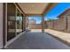 Covered patio featuring concrete flooring and views of the surrounding yard, perfect for outdoor living at 1914 N Marketside Ave, Buckeye, AZ 85396