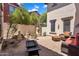 Relaxing backyard with brick pavers, outside furniture, and beautiful garden area at 20507 W Daniel Pl, Buckeye, AZ 85396