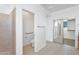 Bright bathroom with a doorway leading to the toilet and large mirrored closet at 20507 W Daniel Pl, Buckeye, AZ 85396