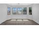 Bright bedroom featuring large windows offering natural light and neighborhood views at 20507 W Daniel Pl, Buckeye, AZ 85396