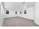 Open bonus room offering neutral walls and carpeting and ample natural light at 20507 W Daniel Pl, Buckeye, AZ 85396