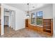 Dining room featuring built-in shelves, drawers, and window seating area at 20507 W Daniel Pl, Buckeye, AZ 85396