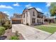 Beautiful home showcasing neutral stucco, tile roof, attached garage, and a well-manicured lawn on a sunny day at 20507 W Daniel Pl, Buckeye, AZ 85396