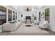 Bright living room with recessed lighting, large windows, and neutral decor at 20507 W Daniel Pl, Buckeye, AZ 85396
