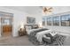 Luxurious main bedroom featuring bright windows and a full ensuite bathroom at 20507 W Daniel Pl, Buckeye, AZ 85396