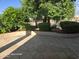 Spacious backyard with manicured landscaping providing a tranquil outdoor living space and a flagstone patio at 20641 N 110Th Ave, Peoria, AZ 85373