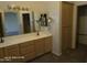 Bathroom vanity featuring double sinks and a medicine cabinet at 20641 N 110Th Ave, Peoria, AZ 85373